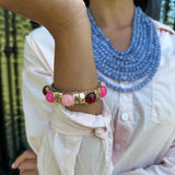 Dome Shaped Gold Bangle with Pink Accented Stones