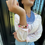 Dome Shaped Gold Bangle with Pink Accented Stones