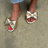 Solei Sea Rafie Metallic Gold Bow Sandals in Gold