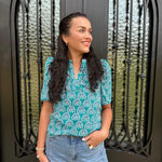 green blouse with floral design 