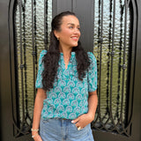 green blouse with floral design 