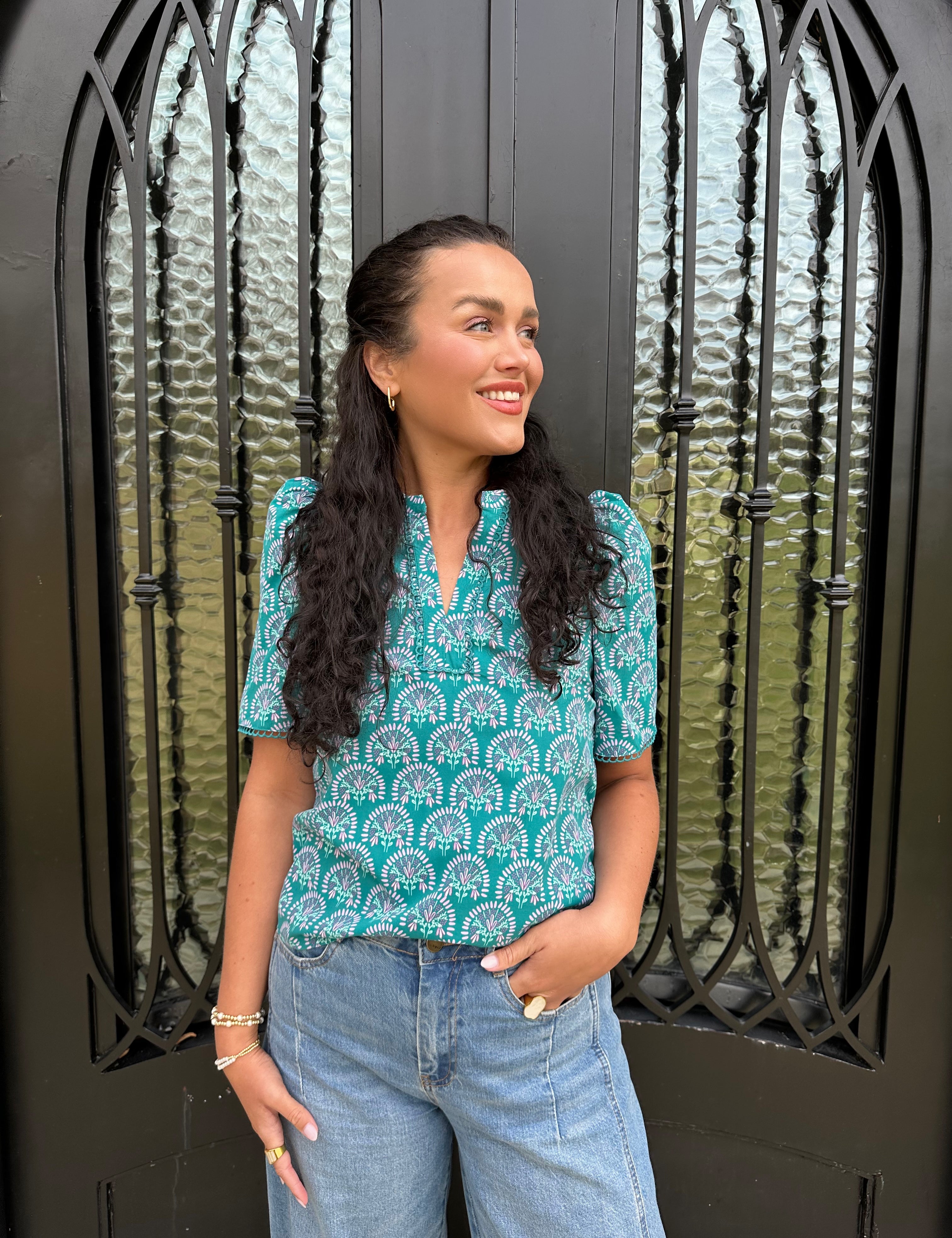 green blouse with floral design 