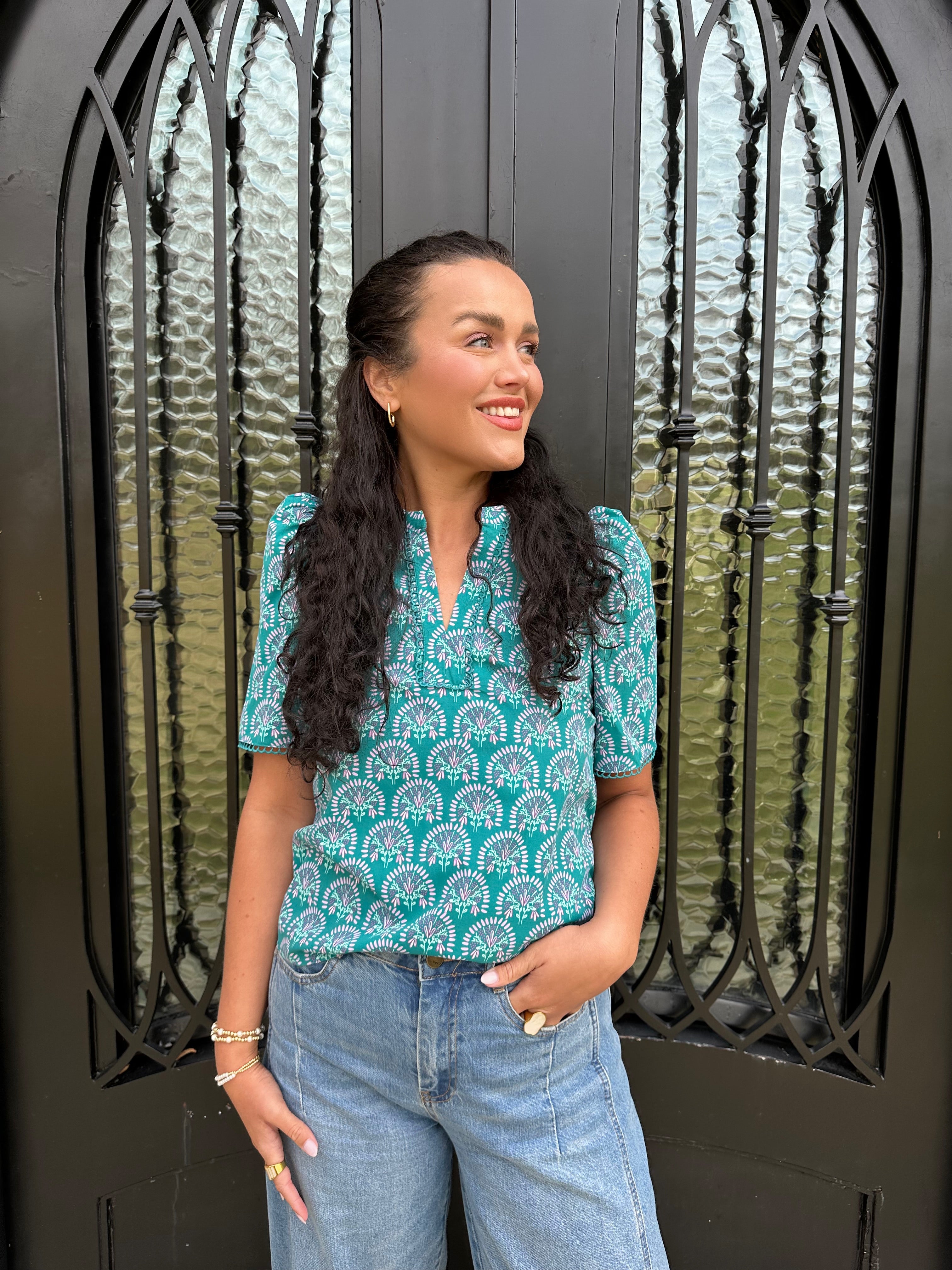 green blouse with floral design 