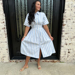 Adorable Blue and White striped button up midi dress with cinched waist and beige sandals 