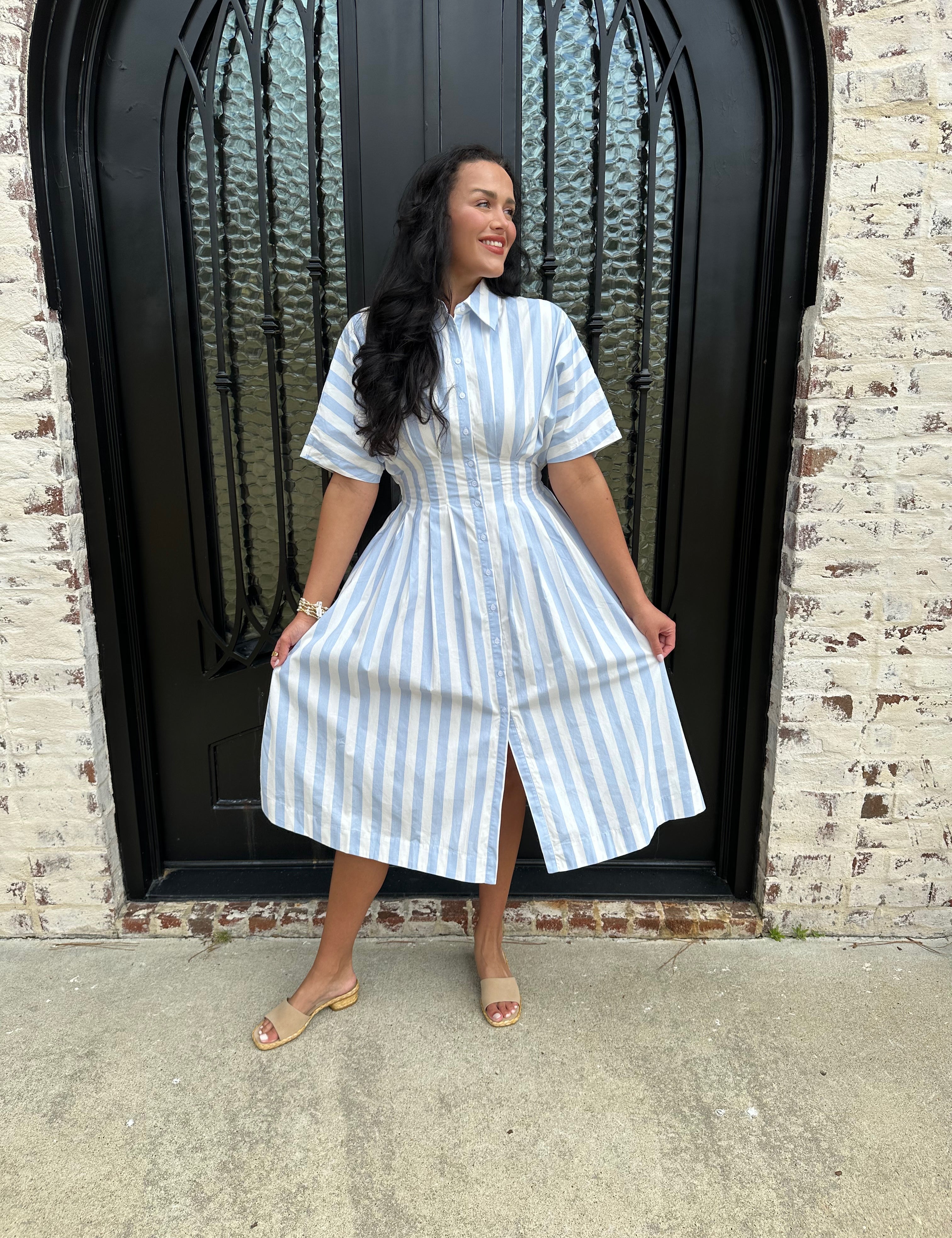 Adorable Blue and White striped button up midi dress with cinched waist and beige sandals 