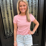 light wash denim shorts with light pink fitted short sleeve top