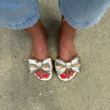 Solei Sea Rafie Metallic Gold Bow Sandals in Gold