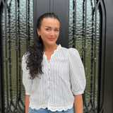 Striped navy and white scalloped blouse with v neckline