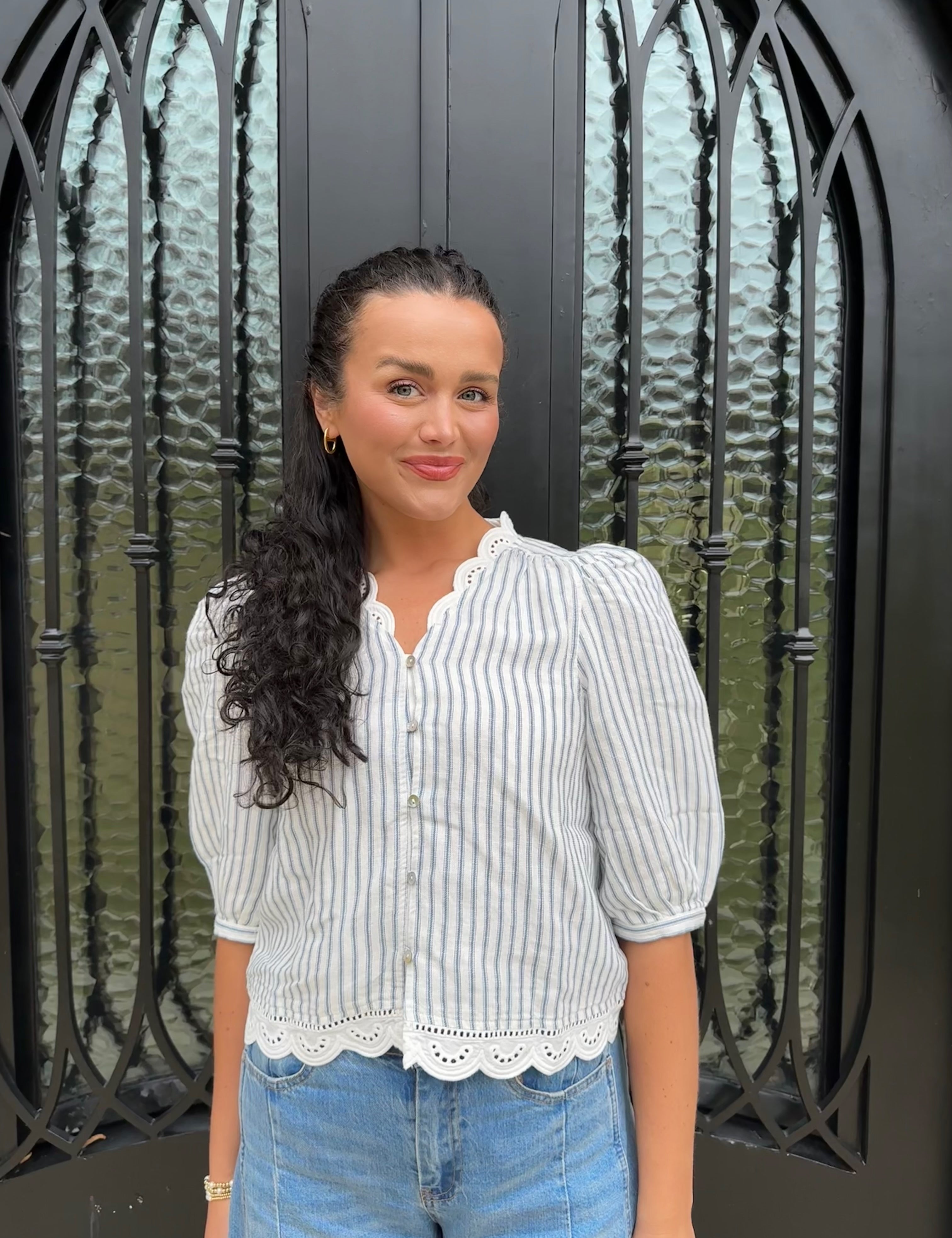 Striped navy and white scalloped blouse with v neckline