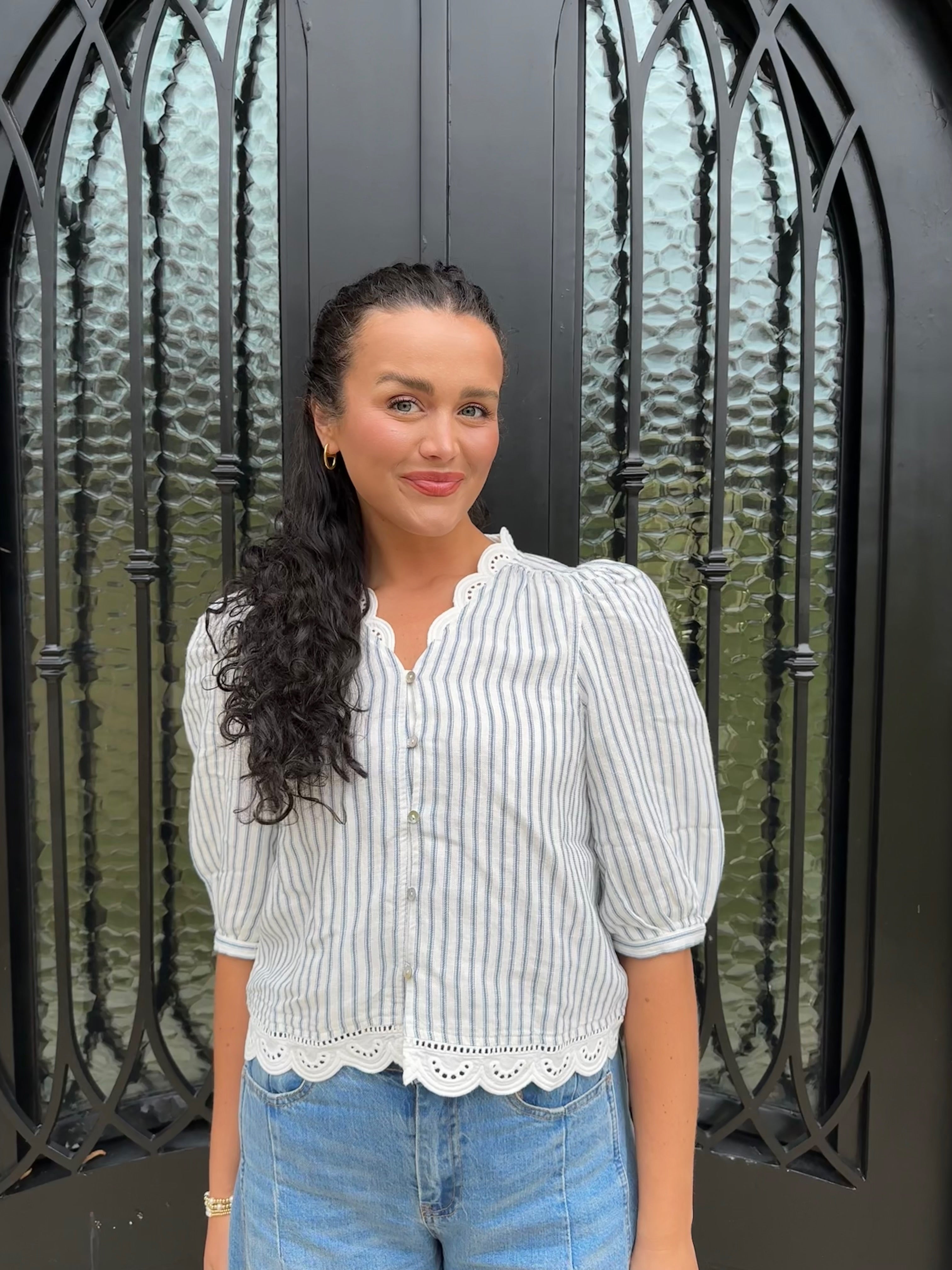 Striped navy and white scalloped blouse with v neckline